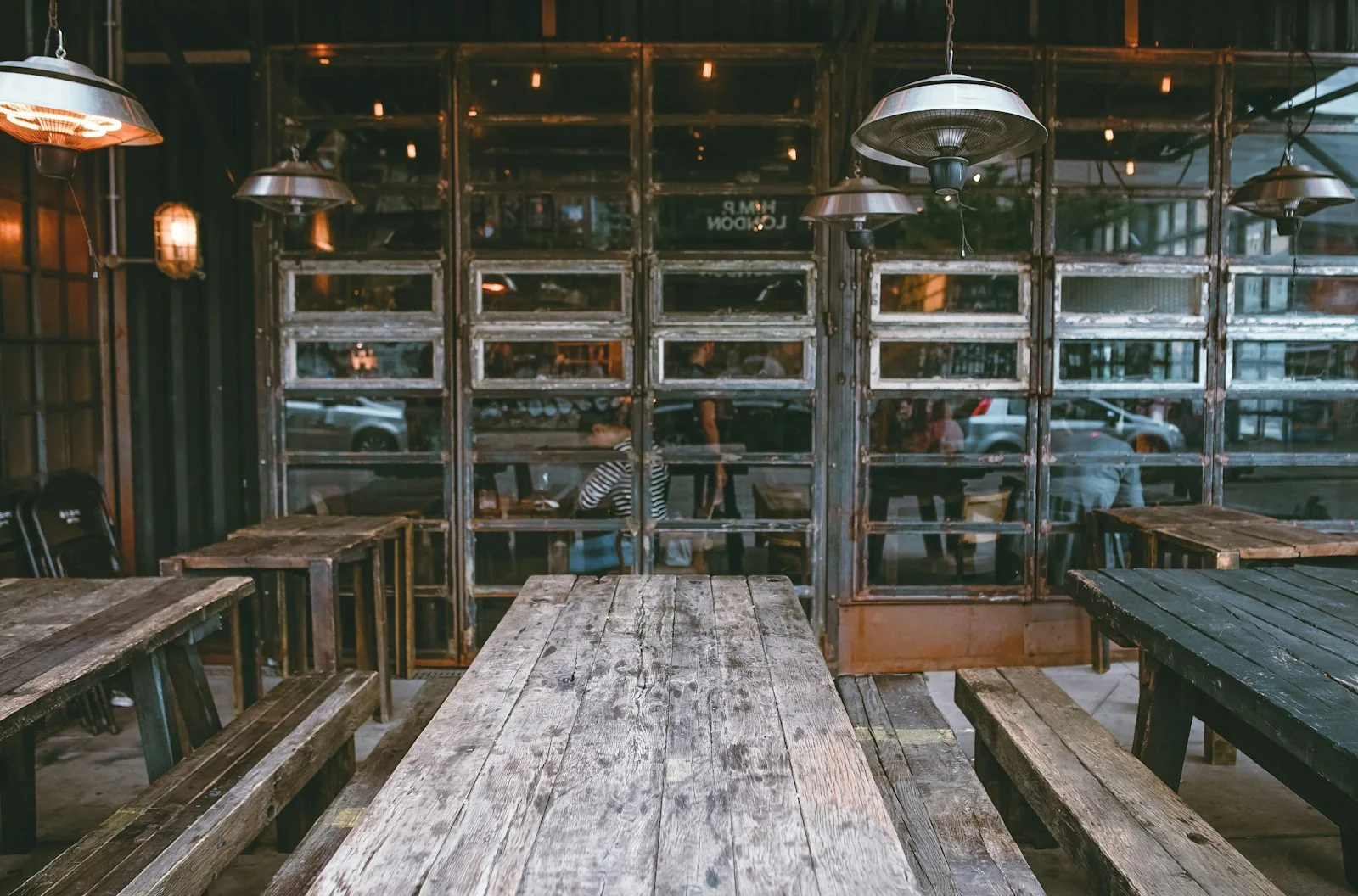 Welcoming restaurant with timber tables and warm pendant lighting